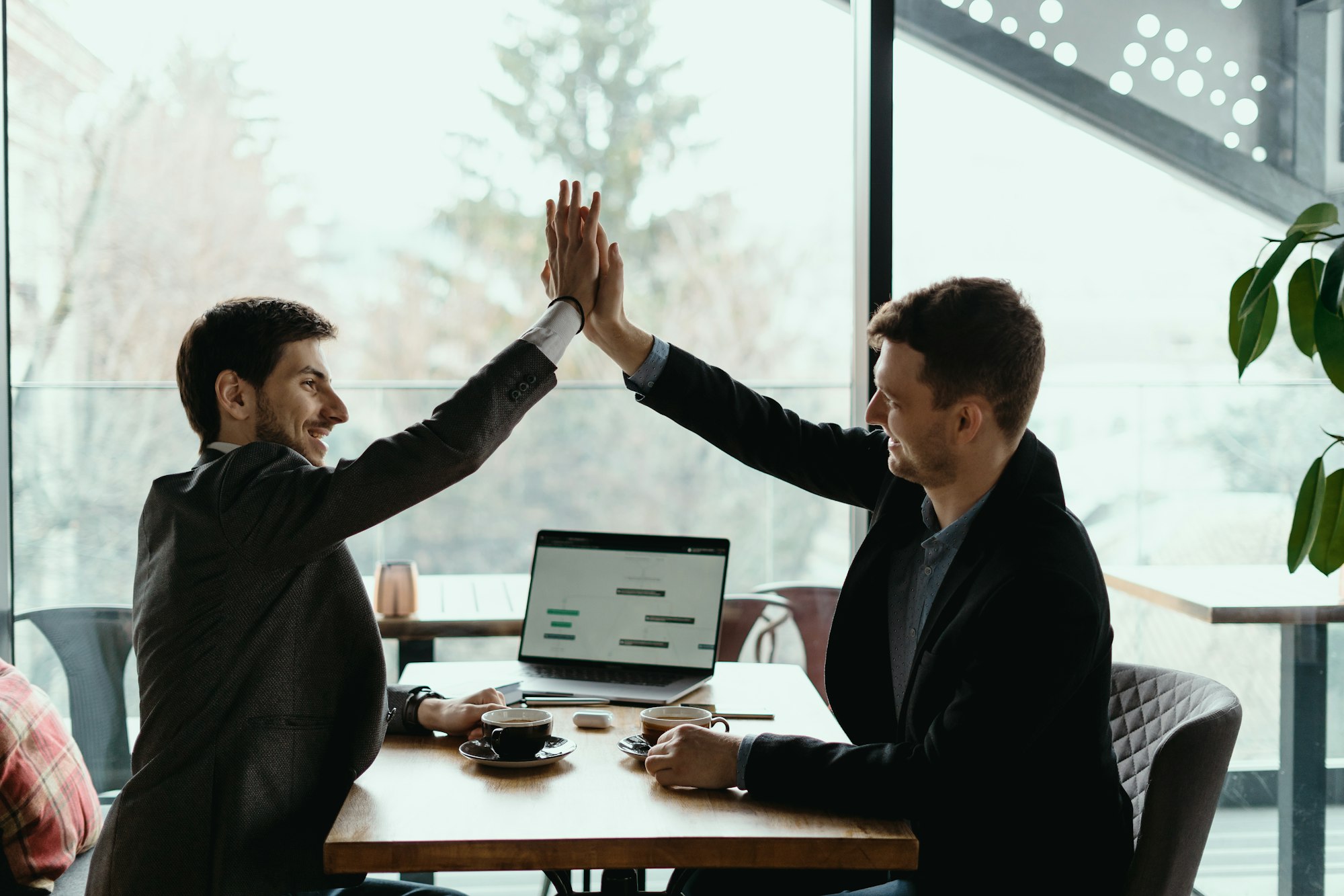 Two business men celebrating a deal